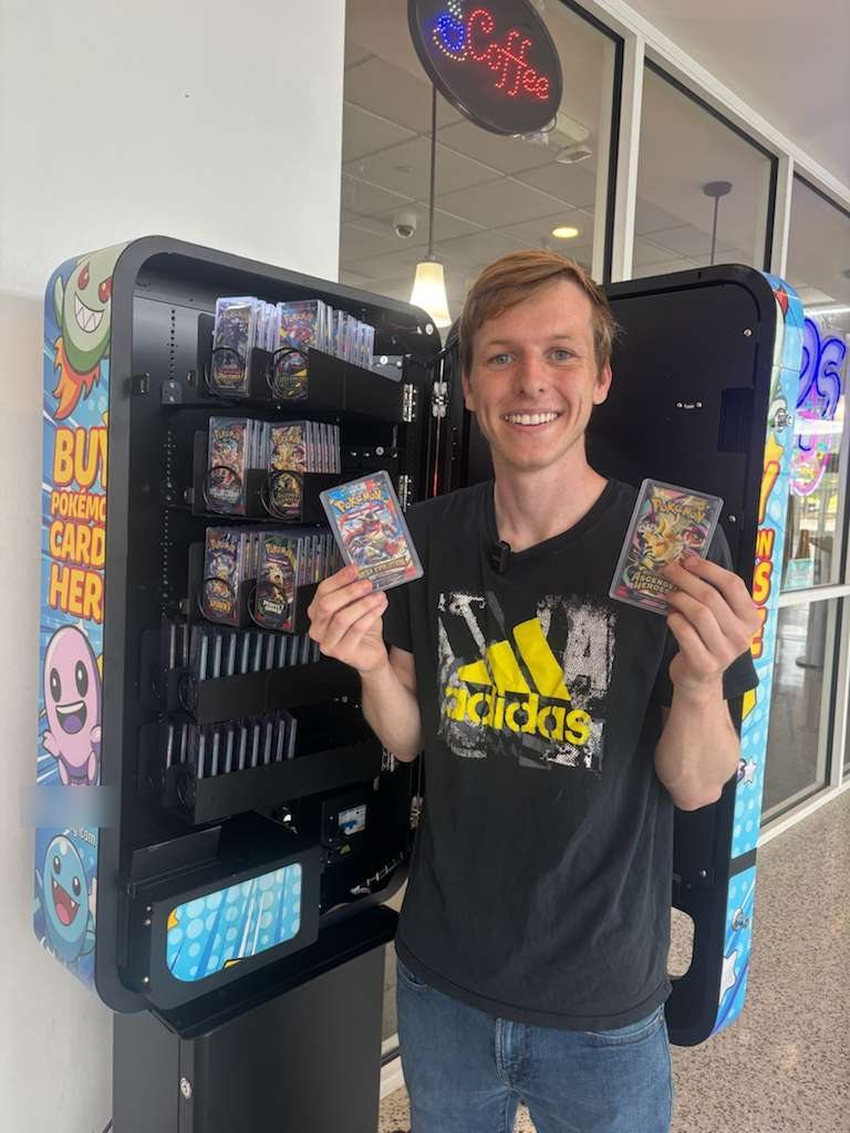 @thefinancialwolf holding packs from a stocked machine
