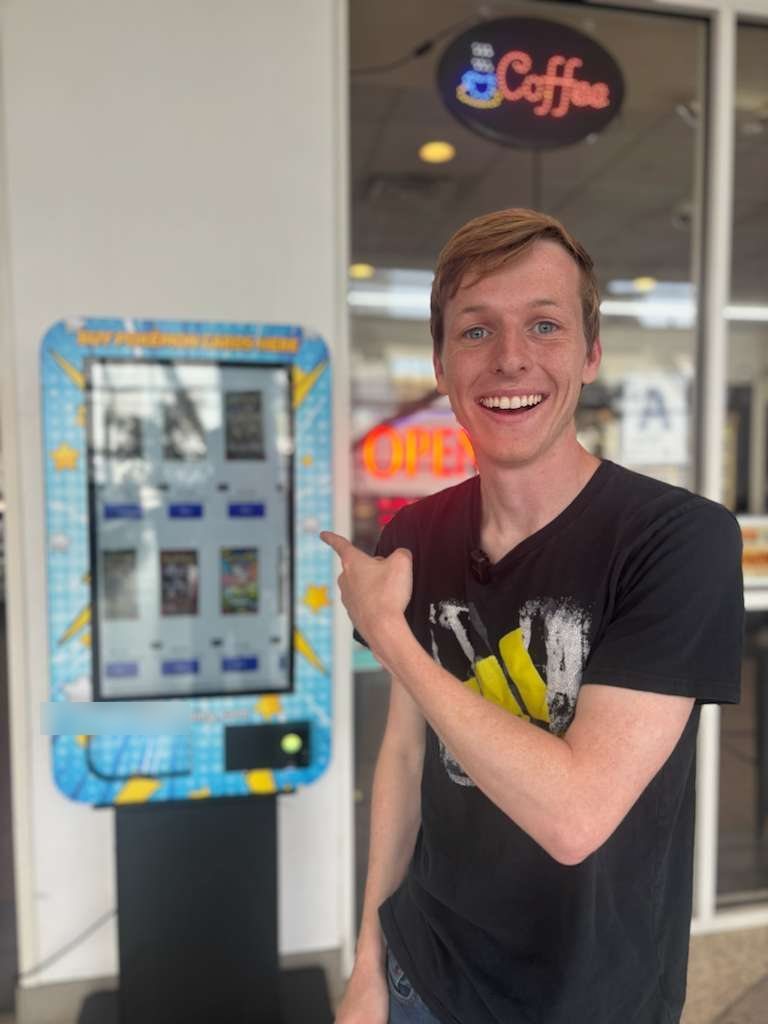 @thefinancialwolf next to a live card vending machine